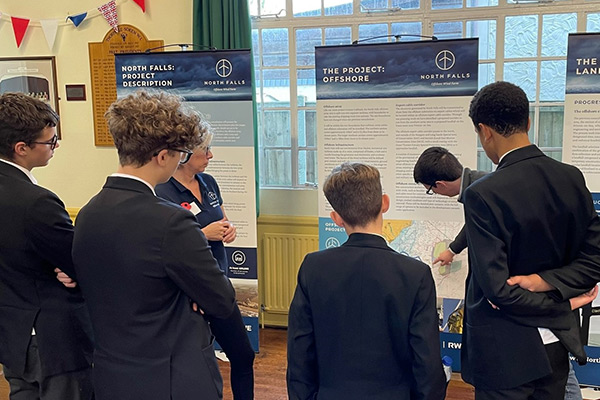 Students looking at exhibition panels